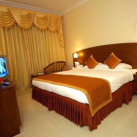Aj International Hotel Bangalore Habitación foto